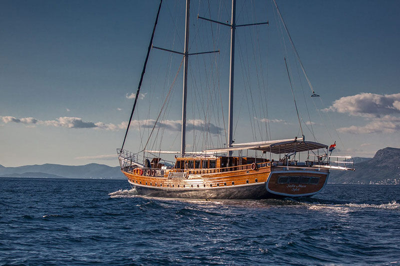 luxury wooden gulet cruising on a sunny day