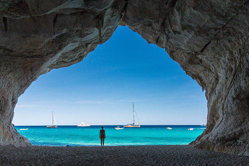 View of the ocean through a cave opening | Sebastus Sailing