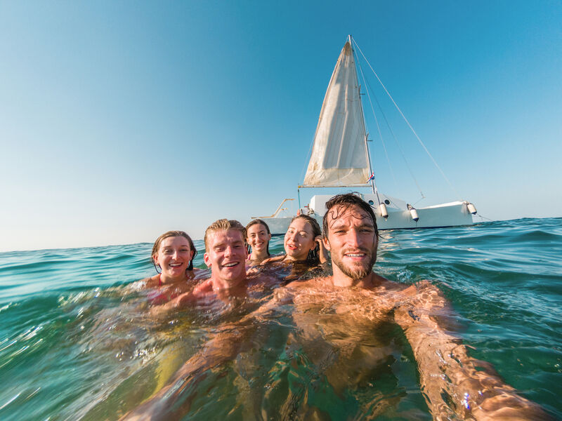 Group of friends swimming | Sebastus Sailing