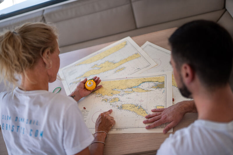 Sailing crew charting route | Sebastus Sailing