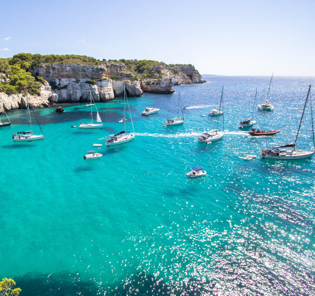 boats anchored in front Macarella beach