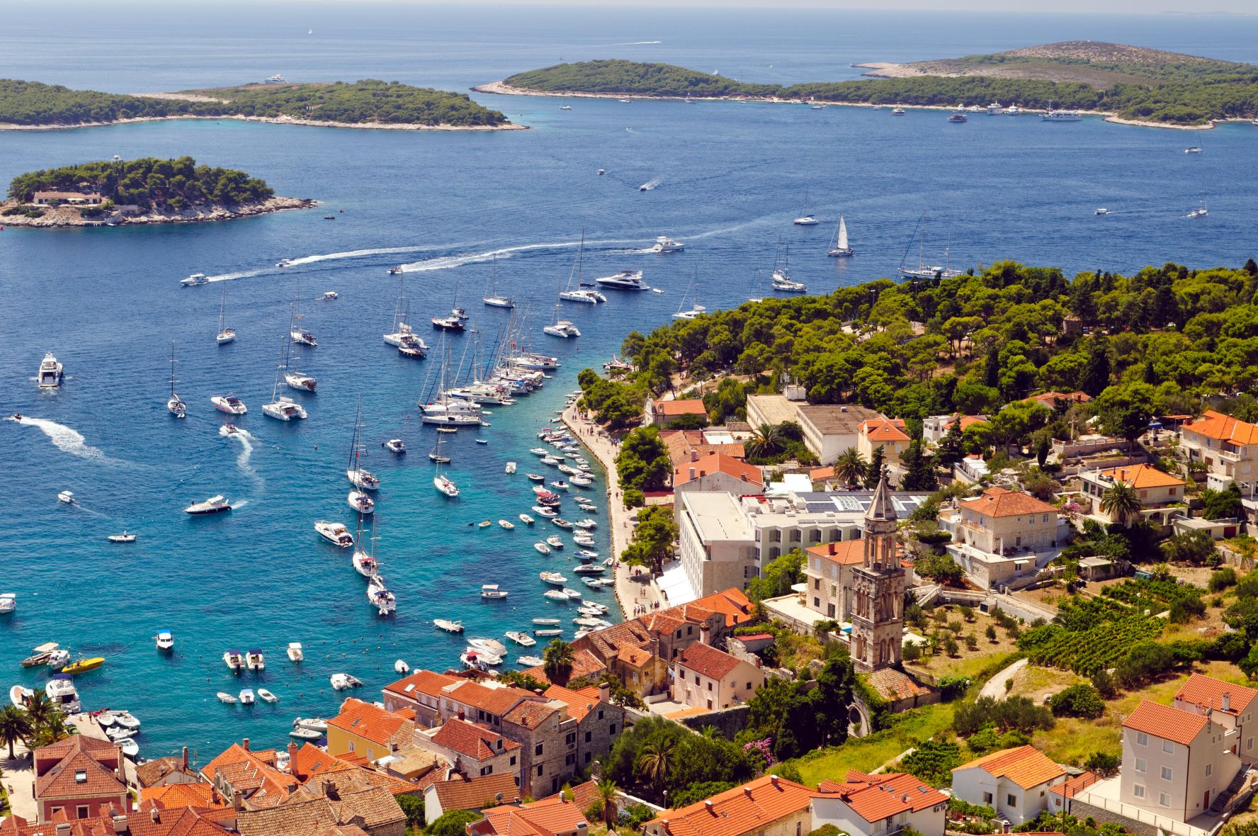 a view to boats anchored in front of Hvar town and to the Pakleni islands
